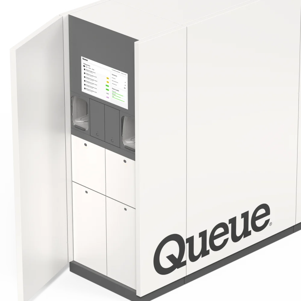 A Queue unit with its service door open, showing the staff screen and storage